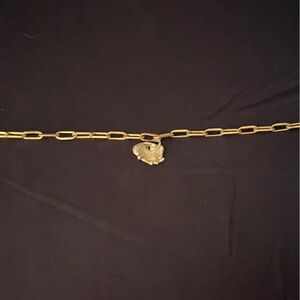 Alice made this gold charm bracelet